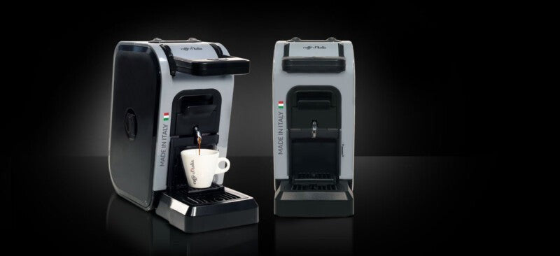 Caffe D'Italia UK - CoffeHome BIRBA grey and black capsule coffee machine brewing espresso into a white cup